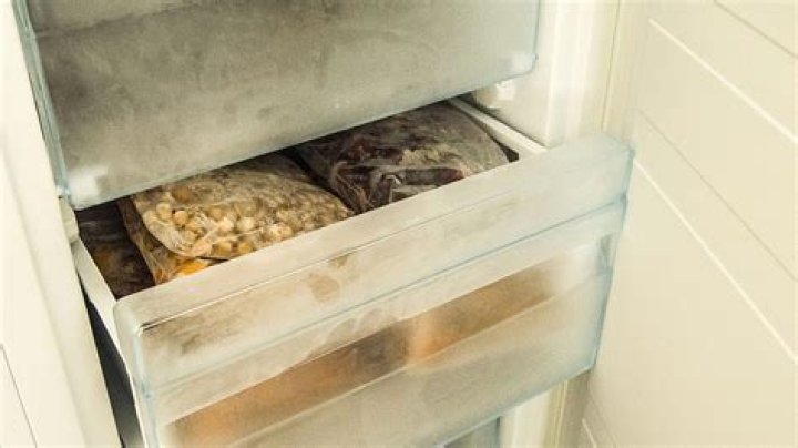 Can I lay a freezer down to transport it