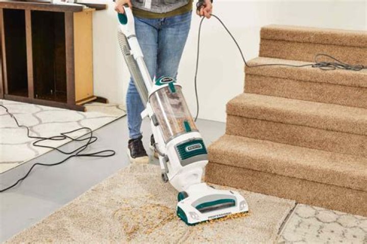 How do I raise my Dyson for thick carpet