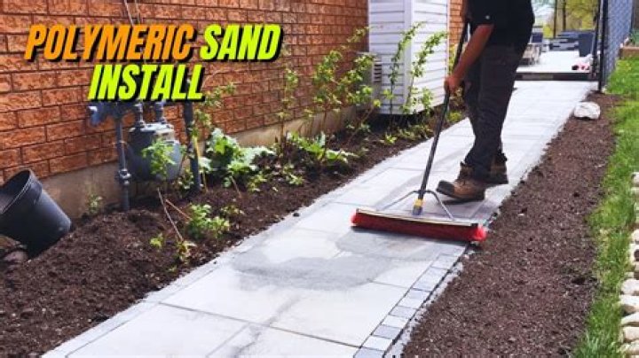 How do you apply polymeric sand to a patio