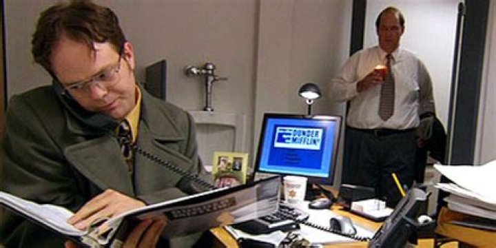 What episode of The Office does Jim put Dwights desk in the bathroom