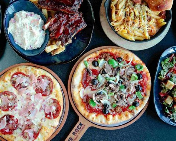 Who owns the Rock Wood Fired Pizza